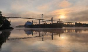 Ship coming out of the fog Under the thousand island bridge while fishing. Alexandria Bay, New York. Recreation. Jeffery L. Orbaker.