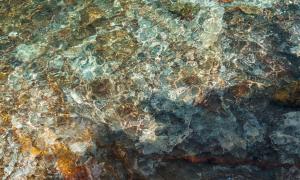 The water ripples over the colorful rock lakebed at Pictured Rocks National Lakeshore. Pictured Rocks, Michigan. Great Lakes Water in Action. Chris Ingham.