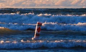 A windy day along the eastern shores of Lake Huron. Wait until the wind dies down, or swim at your own risk and have fun in those waves. Port Elgin, Ontario. Recreation. Elizabeth Oldfield.