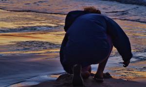 Our family cherished our passive, relaxing time spent drawing in the sand, listening to the swishing waves, and looking at beautiful rocks at sunset. Summer along the eastern shore of Lake Huron. Port Elgin, Ontario. Recreation. Elizabeth Oldfield.
