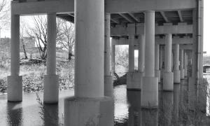 An overpass built in and over the Scajaquada Creek in Buffalo, New York, which flows into the Niagara River. This image represents the dark side of human and economic activity including burying creeks, polluting drinking water in many ways, and altering pre-settlement landscapes to an unrecognizable state. Buffalo, New York. Great Lakes Water in Action. Elizabeth Oldfield.