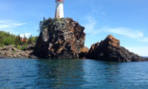 Battle Island, Light House, 6 miles out of Rossport the windows are 122 feet off the high water mark. Rossport. Battle Island Light House, Ontario. Great Lakes Water in Action. Paul Turpin.