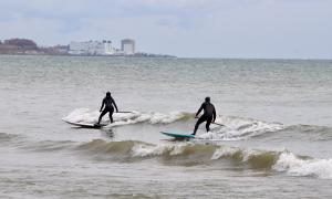 Surfing on Lake Ontario in Oshawa Ontario. Oshawa, Ontario. Recreation. Angela Millard