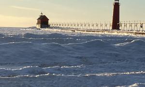 Shelf Ice wraps the Great Lakes Shoreline in winter. Ice-cover influences shoreline morphology, lake ecology, and regional weather. It shields shorelines from storm erosion, provides shelter for fish eggs, affects evaporation, regulates regional weather, and impacts shipping. With ice-cover decreasing, there is an urgent need to comprehend winter-ice dynamics. Grand Haven, Michigan. Great Lakes Water in Action. Bopi Biddanda.