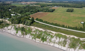 Bluff erosion is eating away at Old Dexter Line under Kettle Creek Conservation Authority's jurisdiction. To stay safe and connected, the community built the New Dexter Line just north of the threatened road (community-driven adaptation action). Central Elgin, Ontario. Great Lakes Water in Action. Katie Franken.