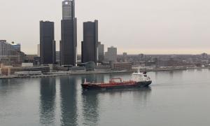 A view of a merchant ship on the Detroit River looking from Windsor, ON in Canada towards Detroit, MI in the U.S. Windsor, Ontario. Great Lakes Water in Action. Dawn Schilling.