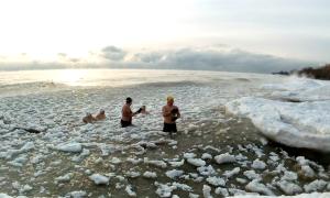 We are Ice Swimmers - every Saturday morning all seasons, at various spots all along the shores of Lake Ontario. We love the cold and camaraderie of swimming together. Jack Darling Park Mississauga, Ontario. Recreation. Sharon Purdy.