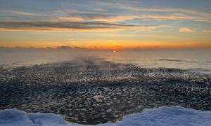 Sunrise in January. The water is filled with ‘ice balls’ The water temperature was close to 0c. The air was -20c. Hence the mist rising above the water. Jack Darling Park, Mississauga, Ontario. Great Lakes Water in Action. Sharon Purdy 
