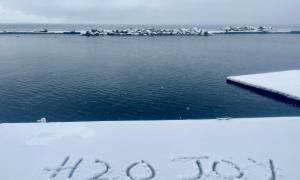 First snow fall of the season - a serenity that descends upon the lake that only Winter can provide. All seasons are beautiful on the lake. But Winter is especially magical and joyful. Humber Bay Toronto, Ontario. Great Lakes Water in Action. Sharon Purdy